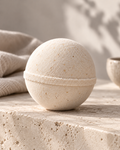 BARE fragrance-free oatmeal bath bomb by Topanga Republic on natural limestone.